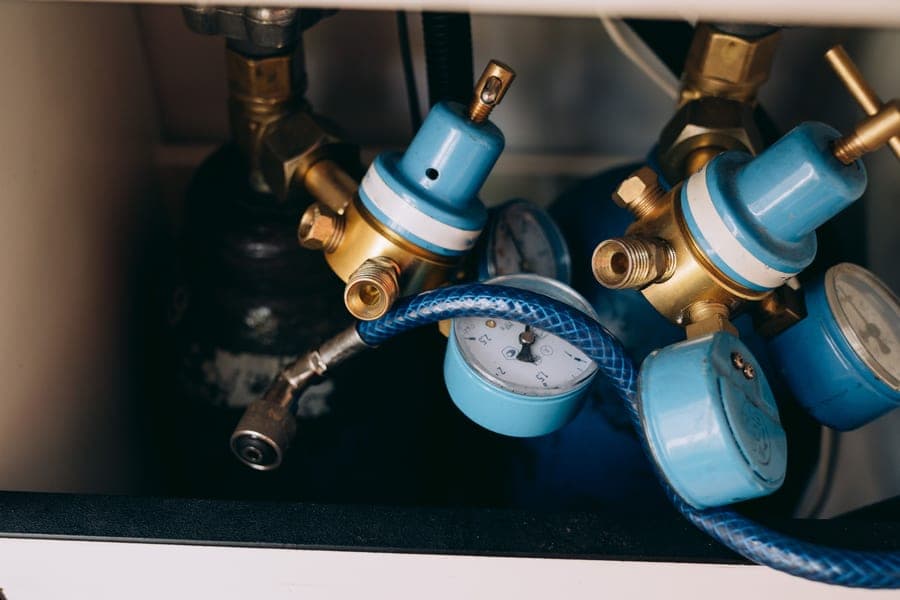 Dual gauge CO2 regulator mounted to a gas cylinder