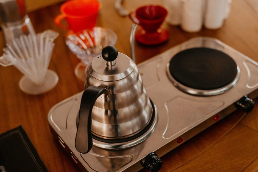 Stainless electric all-in-one brewing system on a kitchen counter